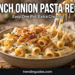 Bowl of creamy French onion pasta with melted cheese and caramelized onions