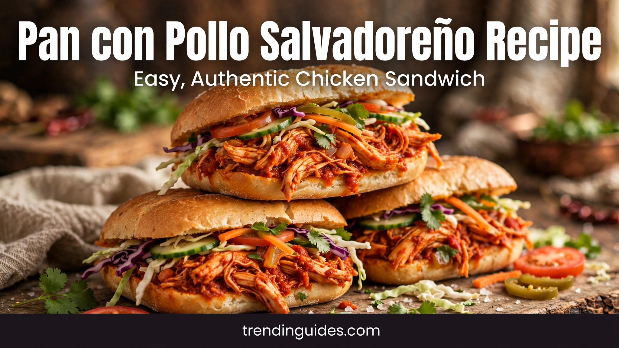 Pan con pollo Salvadoran chicken sandwiches stacked on a board