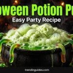 Halloween potion punch in a black cauldron with lime sherbet foam and gummy worms